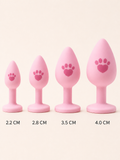 Four pink paw-print silicone tail plug sizes from 2.2 to 4.0 cm
