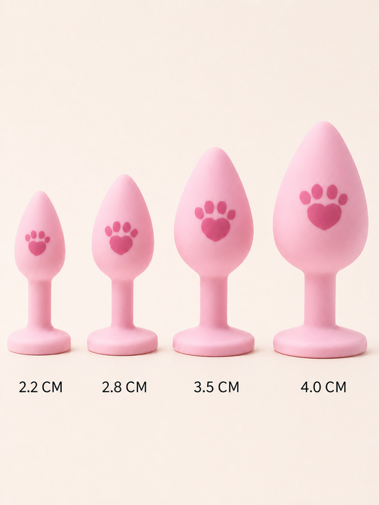 Four pink paw-print silicone tail plug sizes from 2.2 to 4.0 cm