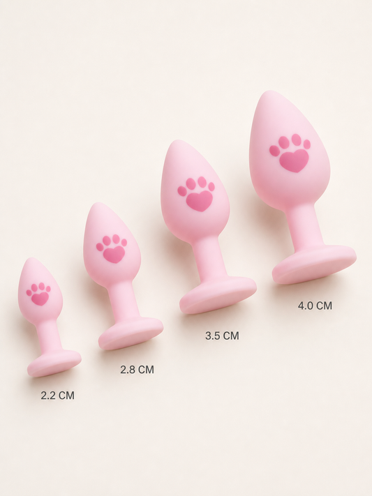 Four pink silicone tail plugs in angled size progression