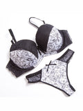 Paisley Noir Black and White lace bra and thong set — flat lay