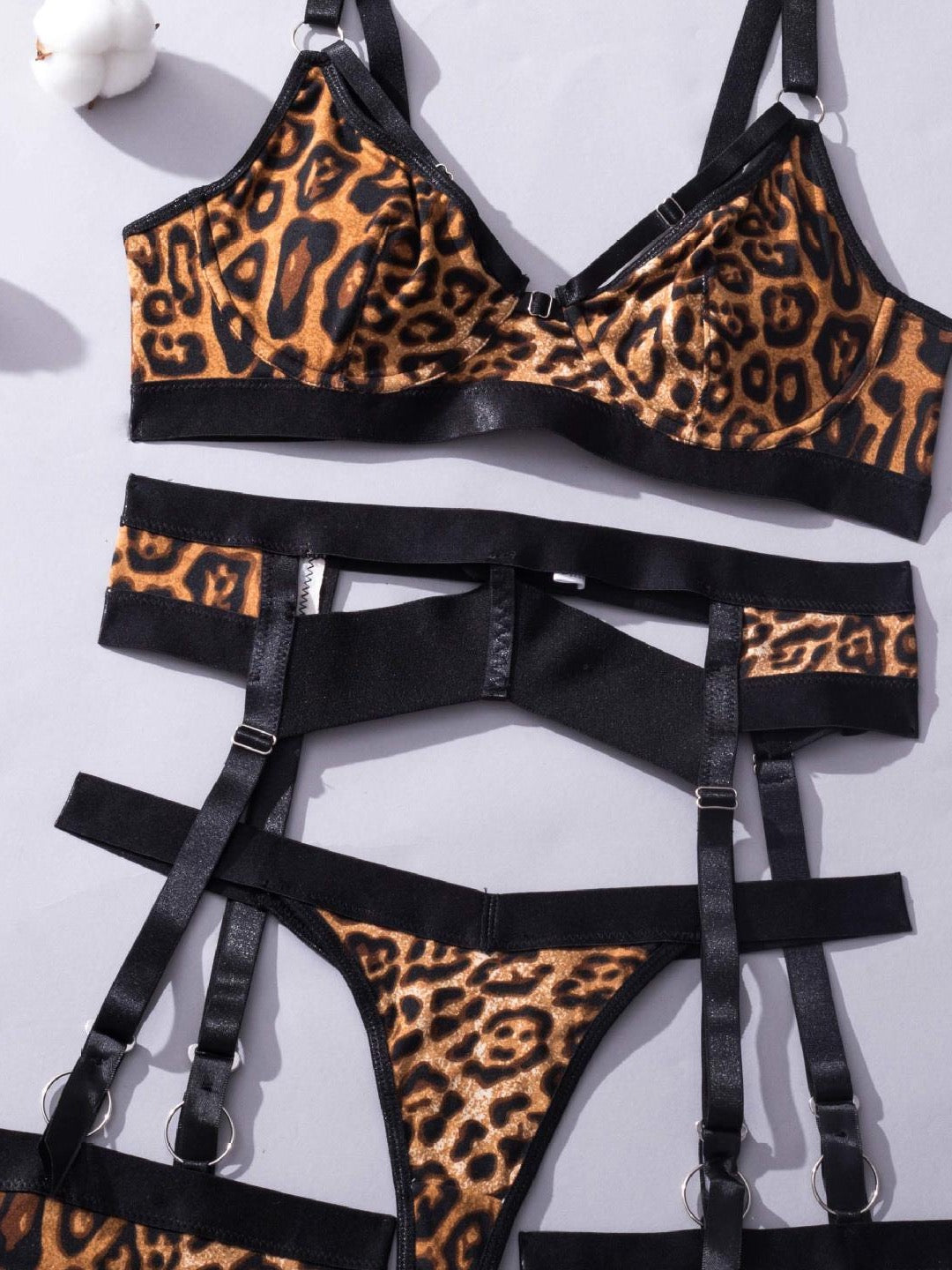 Leopard After Dark lingerie set — component flat lay