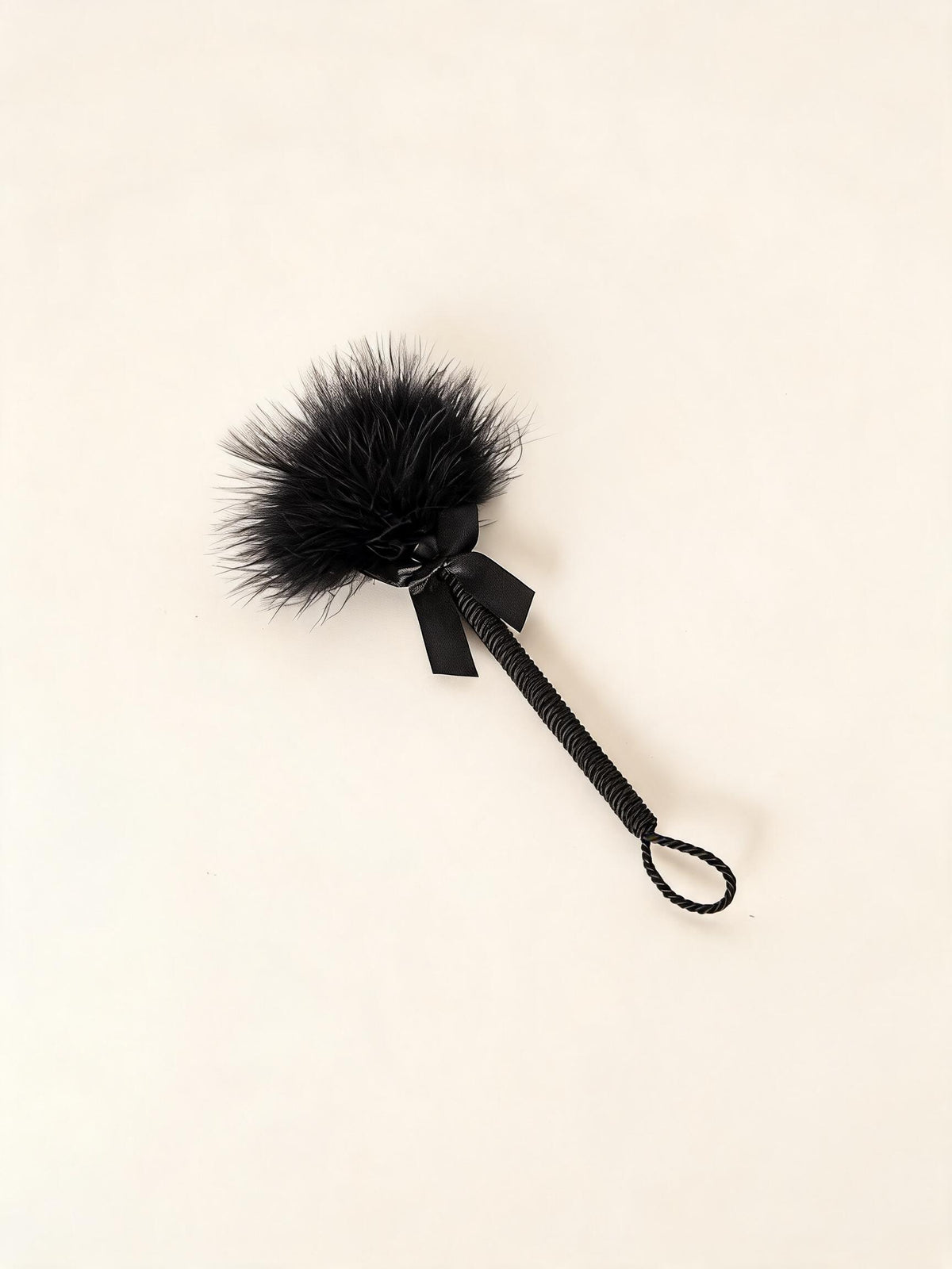 Short black feather tickler with wrapped handle and wrist loop — high-resolution product view