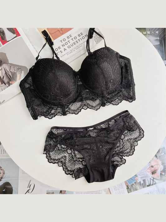 Sculpted Lace Support black plus size bra and panty set — flat lay
