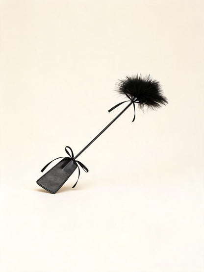 Long black feather tickler wand with paddle handle — high-resolution product view