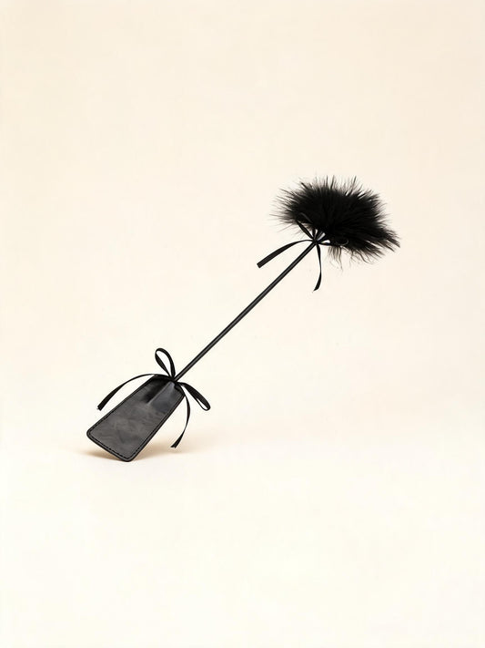 Long black feather tickler wand with paddle handle — high-resolution product view