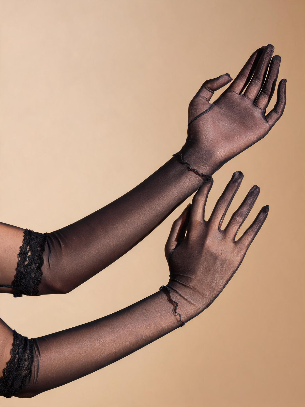 Glossy black sheer lace gloves, forearms and hands detail